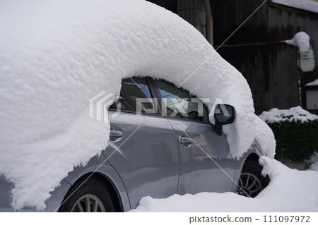 Private car covered in snow Private car covered in snow 111097972