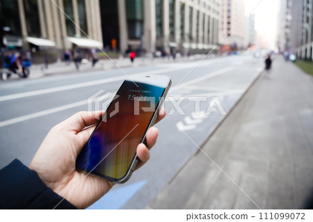 people walking around town 111099072