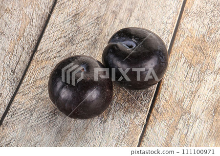 Two ripe sweet black plums 111100971