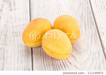 Ripe sweet juicy apricot heap 111100972