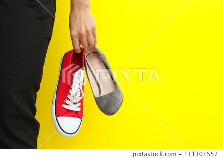 The concept of work-life balance, casual and office footwear. The concept of work-life balance, casual and office footwear. 111101552