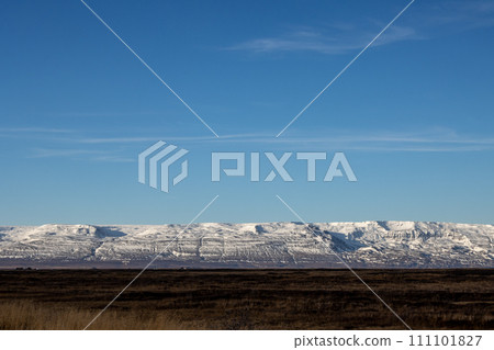 Line of mountains with snow, Borgarfjordur, Iceland 111101827