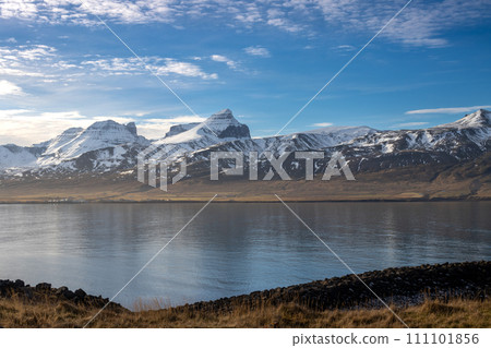 Fjord and snowy mountains in the autumn, North-East Iceland 111101856