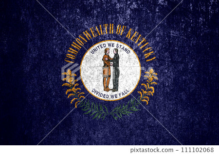 Close-up of the Kentucky grunge state flag. Dirty Kentucky state flag on a metal surface. Close-up of the Kentucky grunge state flag. Dirty Kentucky state flag on a metal surface. 111102068