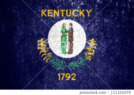 Close-up of the Kentucky grunge state flag. Dirty Kentucky state flag on a metal surface. Close-up of the Kentucky grunge state flag. Dirty Kentucky state flag on a metal surface. 111102070