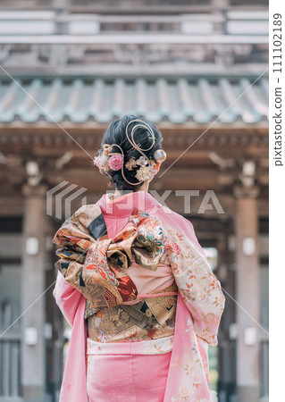 A woman in a kimono A woman in a kimono 111102189