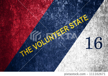 Close-up of the grunge Tennessee state flag. Dirty Tennessee state flag on a metal surface. Close-up of the grunge Tennessee state flag. Dirty Tennessee state flag on a metal surface. 111102671