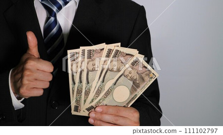 Businessman holding a lot of money and posing 111102797