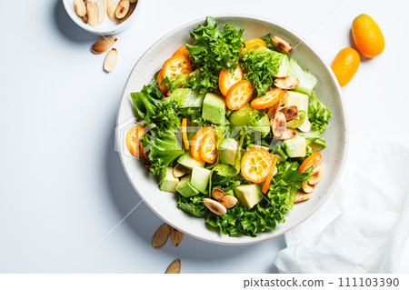 Kumquat salad with avocado and nuts. Kumquat salad with avocado and nuts. 111103390