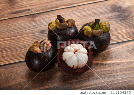 Sweet ripe juicy tropical Mangosteen Sweet ripe juicy tropical Mangosteen 111104370