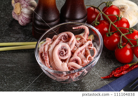 Delicous marinated squid tentacles in the bowl 111104838