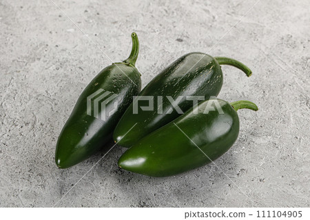 Raw green Mexican jalapeno pepper Raw green Mexican jalapeno pepper 111104905