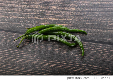 Hot and spicy green chili pepper 111105567