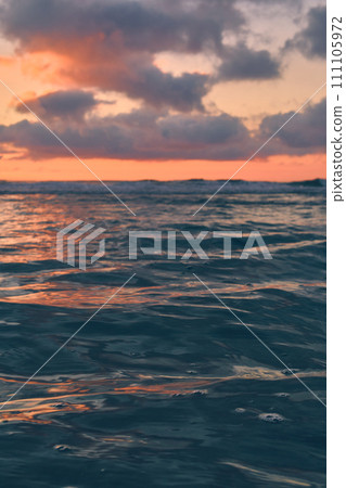 Calm and Colorful waves in sunset light 111105972