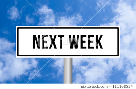 Next week road sign on blue sky background 111108534