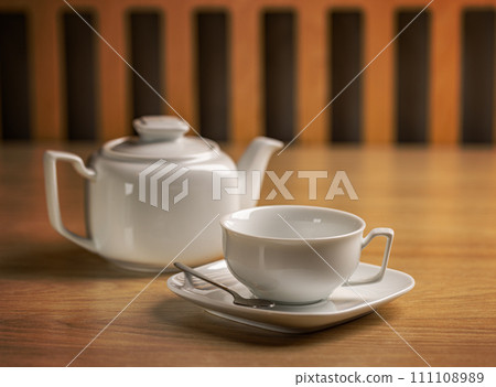 Tea concept with white tea set Tea concept with white tea set 111108989