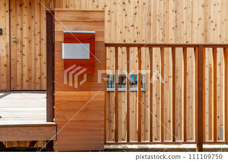 Wooden gateposts and fence, entrance of a house Wooden gateposts and fence, entrance of a house 111109750