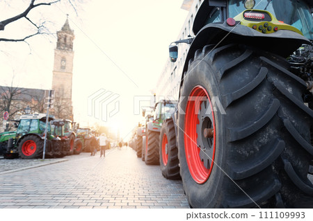 Farmers union protest strike against government Policy in Germany Europe. Tractors vehicles blocks city road traffic. Agriculture farm machines Magdeburg central Domplatz square Farmers union protest strike against government Policy in Germany Europe. Tractors vehicles blocks city road traffic. Agriculture farm machines Magdeburg central Domplatz square 111109993