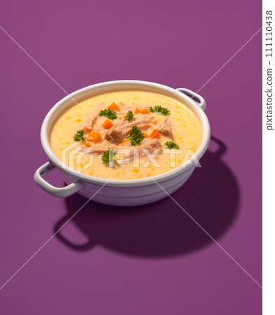 Chicken soup bowl, greek recipe, isolated on a purple background 111110438