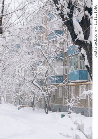 heavy snowfall in the city outside the window. Snow and wind blizzard in winter 111111666