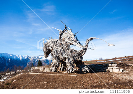 Wooden sculpture of a dragon. Italian landmark 111111906