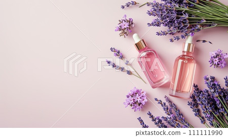 Elegant flat lay of body oils and perfume bottles with lavender sprigs on a pastel background, minimalist style 111111990