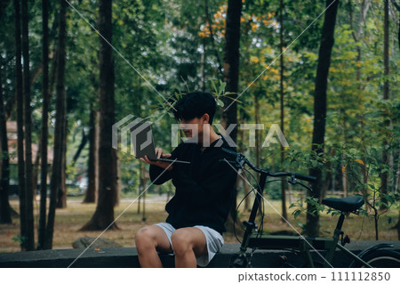 Handsome happy young man with bicycle on a city street, Active lifestyle, people concept 111112850