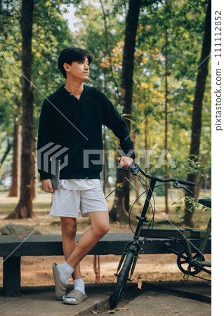 Handsome happy young man with bicycle on a city street, Active lifestyle, people concept Handsome happy young man with bicycle on a city street, Active lifestyle, people concept 111112852