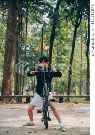 Handsome happy young man with bicycle on a city street, Active lifestyle, people concept Handsome happy young man with bicycle on a city street, Active lifestyle, people concept 111112878