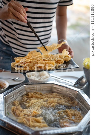 Chinese hot pot with fried tofu skin and lots of delicious ingredients 111112896