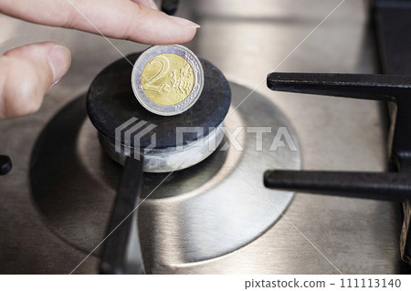 The cost of gas, the euro crisis. a euro coin on the background of a gas burner. 111113140