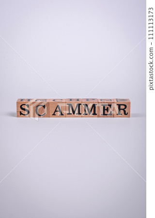 The inscription Scammer made of wooden cubes on a plain background The inscription Scammer made of wooden cubes on a plain background 111113173