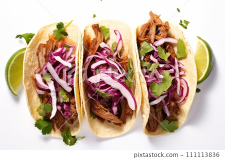 Top view of mexican pork carnitas tacos with greens and purple coleslaw isolated on white background Top view of mexican pork carnitas tacos with greens and purple coleslaw isolated on white background 111113836