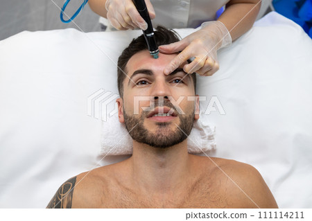 Male patient having current therapy for face 111114211