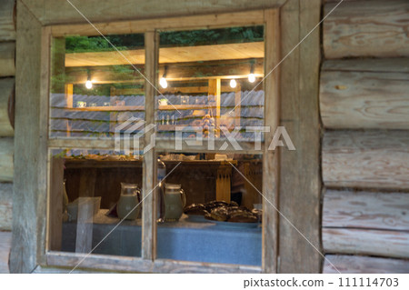 Wooden ethnic house window closeup. 111114703