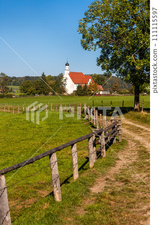 Scenic landscape of historic church and farm lands in Bavaria rural side. Scenic landscape of historic church and farm lands in Bavaria rural side. 111115597