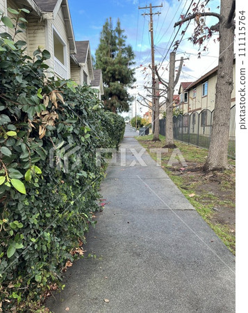 a small house with a red brick pathway 111115764