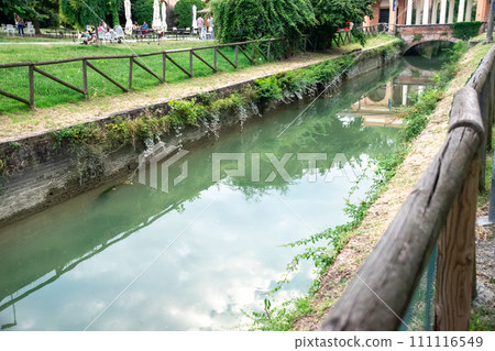 River crossing domestic park with terrace in residential areas of Bologna, Italy 111116549