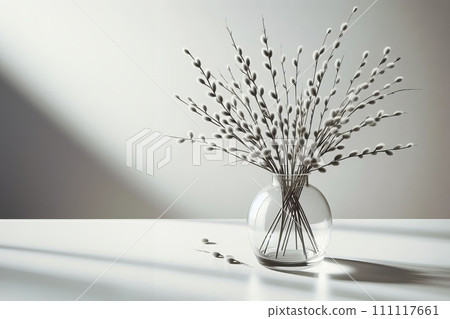 AI-generated content. Generated image of a vase filled with willow plant branches sitting on top of a wooden table, with backlight, with clear glass, sleek round shapes 111117661