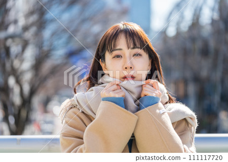 A middle-aged woman waiting for a meeting. 111117720
