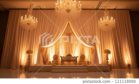 Golden Illuminated Wedding Stage with Elegant Drapery and Chandeliers 111118098