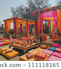 Vibrant Outdoor Indian Wedding Lounge with Colorful Fabrics and Seating 111118165