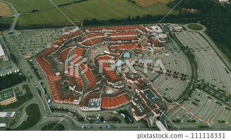 Aerial view of an Italian outlet in Serravalle Scrivia in the evening 111118331