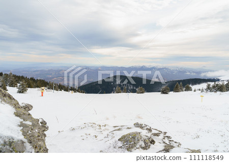 Winter nature snow landscape in the mountains. Fir trees under the snow. Winter nature snow landscape in the mountains. Fir trees under the snow. 111118549