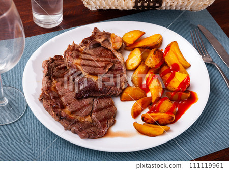 Appetizing beef entrecote with baked potatoes Appetizing beef entrecote with baked potatoes 111119961