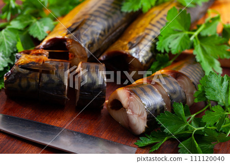 Slices of smoked mackerel served with greens 111120040