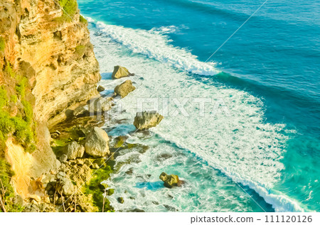 view of cliffs, waves and horizon with clear sky in the background, Uluwatu-Bali 111120126
