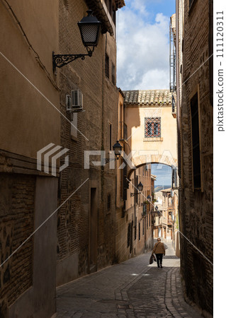 Narrow cobbled streets in old town of Toledo, Spain 111120311