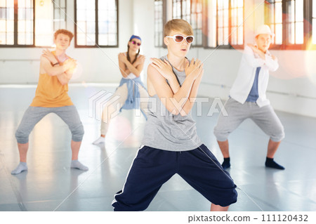 Group of young artists performing street dance 111120432