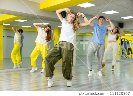 Teen girl in wide pants dancing hip hop Teen girl in wide pants dancing hip hop 111120567